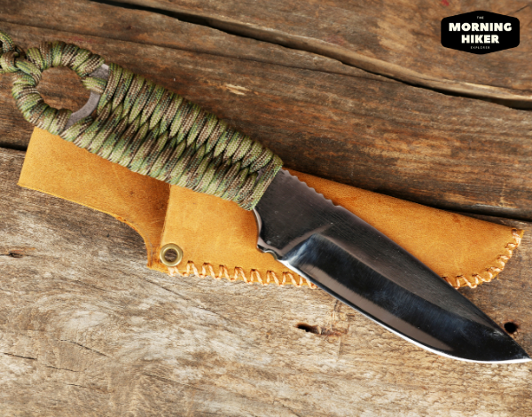 Hunting knife on a wooden table